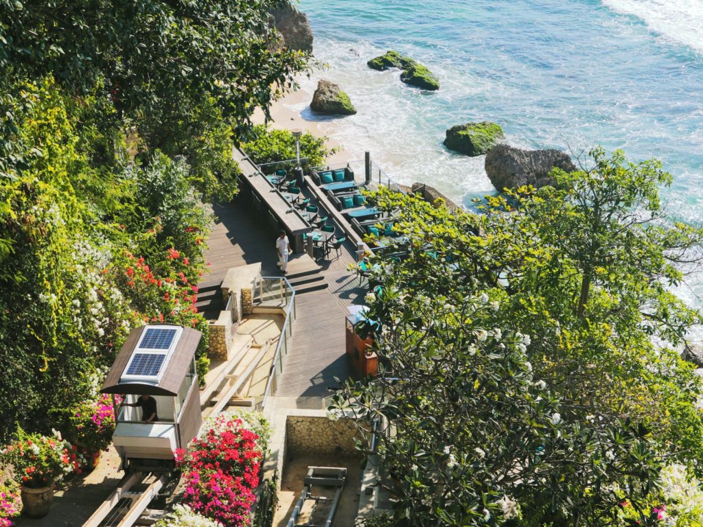 an aerial view of a beach with a solar panel on the roof
